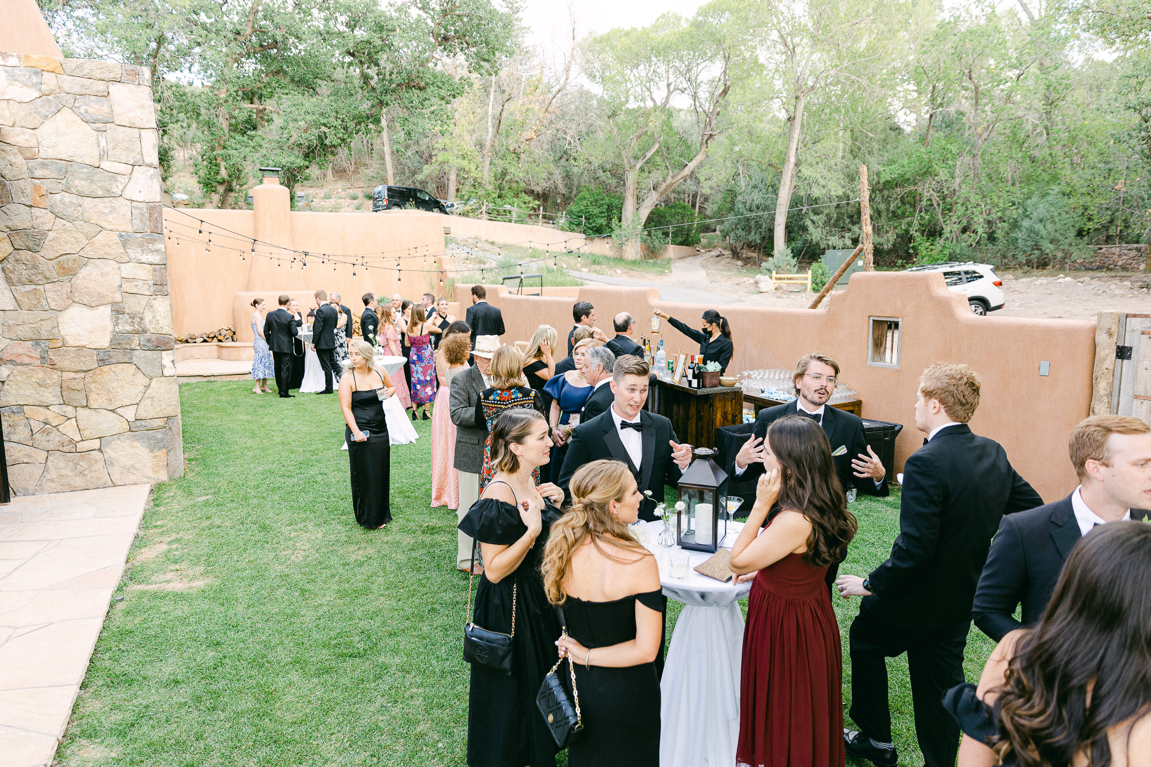 Guests mingle during cocktail hour at a wedding in Santa Fe.
