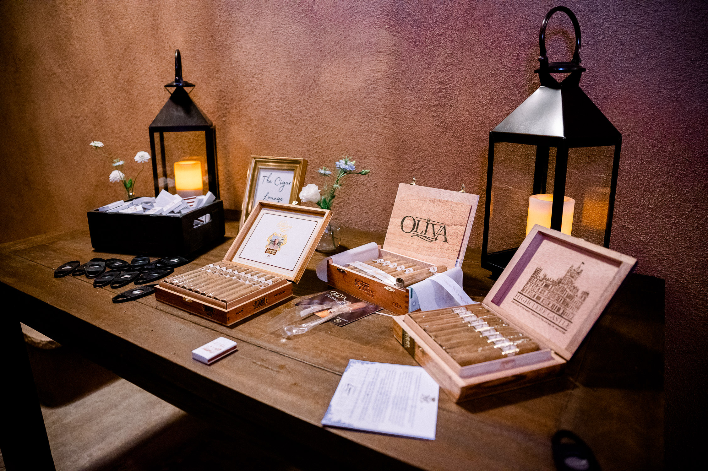 Cigar boxes open on table.